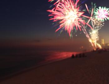 fireworks over beach at night