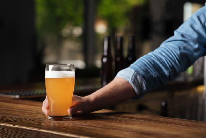 bartender serving a beer