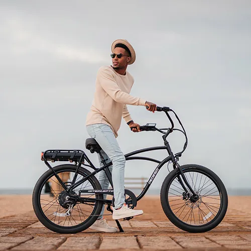 Man riding Pedego electric bike near the beach